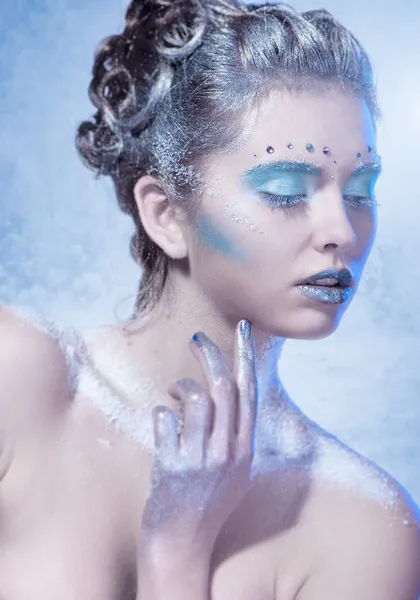 Cold winter Young woman with creative makeup