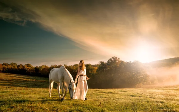 Women with white horse