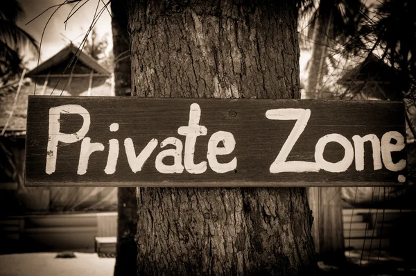 Private zone sign standing for private property restricted access