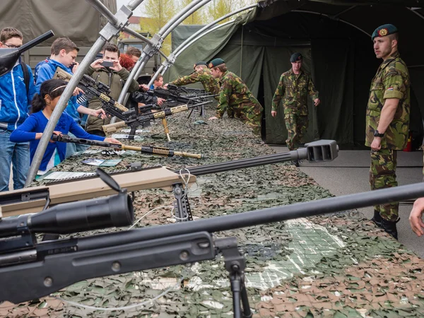 Kids trying rifles on army day