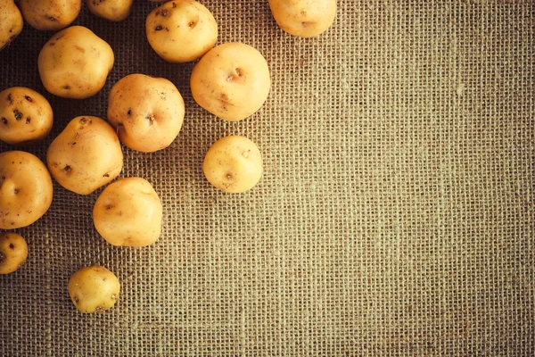 Pile of potatoes on burlap sack