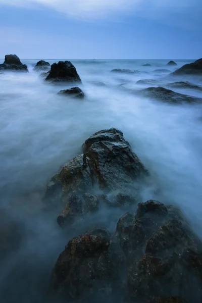 Rock and waves at a beach in Borneo, Sabah, Malaysia