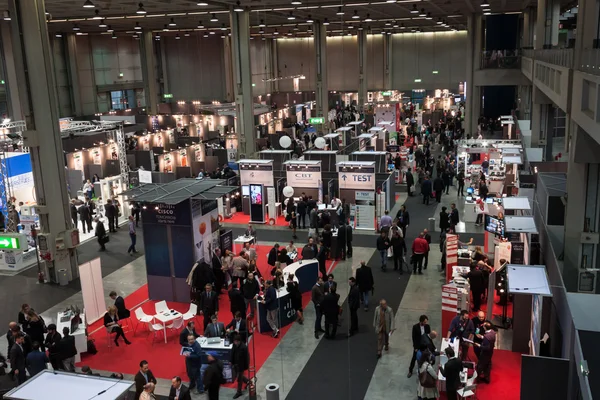 Top view of people and booths at Smau exhibition in Milan, Italy