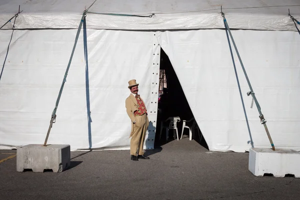 Performer posing outside the big top at Milan Clown Festival 2014