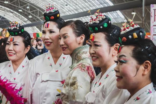 Women in traditional dress at Orient Festival in Milan, Italy