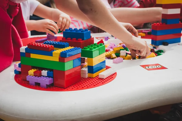 Children play with Lego bricks in Milan, Italy