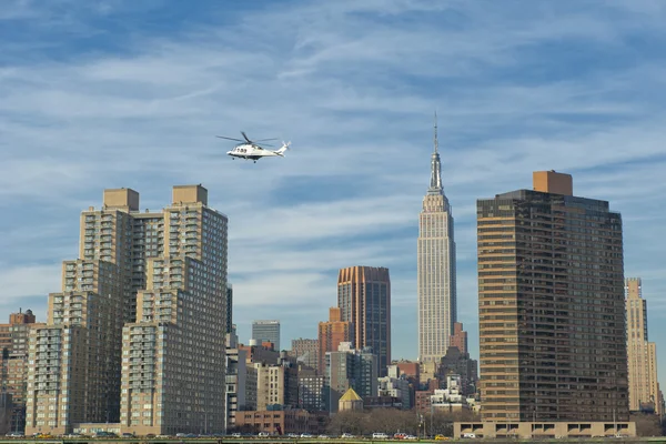 NEW YORK A view from river with Empire state building and Helicopter