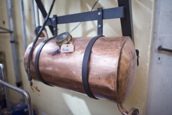 Copper still alembic inside distillery