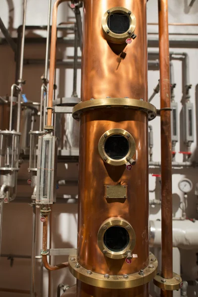 Copper still alembic inside distillery