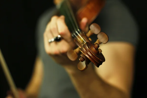 Male hands playing violin