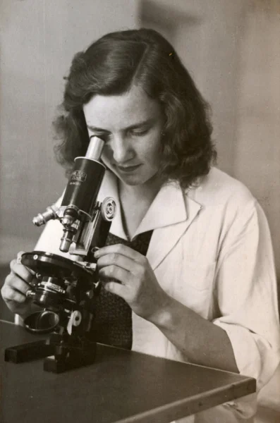 The woman behind the microscope