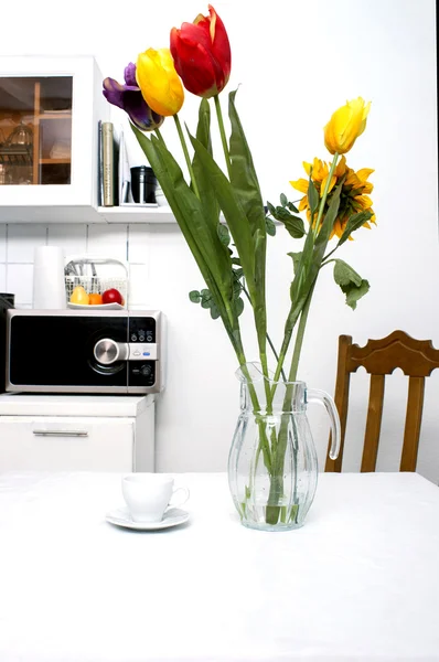 Flowers in the kitchen on a white background