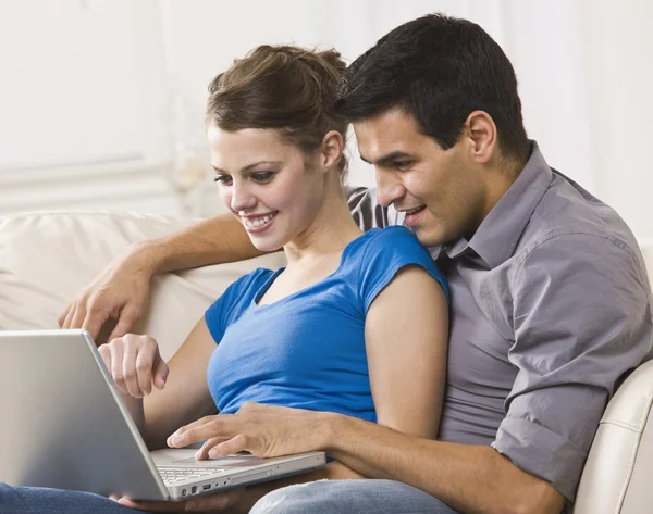 Attractive Couple Working on Laptop Together