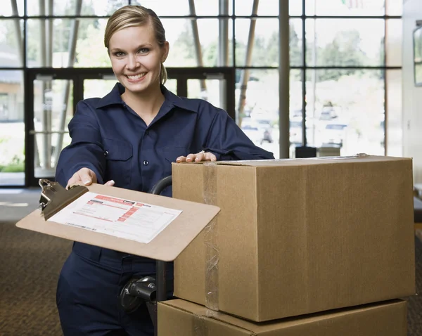 Young Woman Moving Boxes