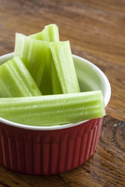 Celery Stalks in a Red and White Bowl