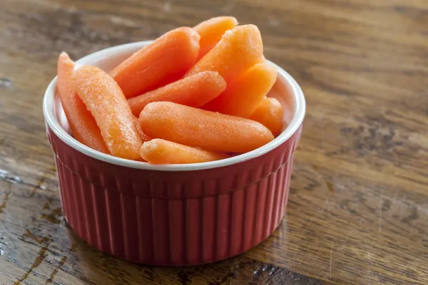 Baby Carrots in a Red and White Bowl