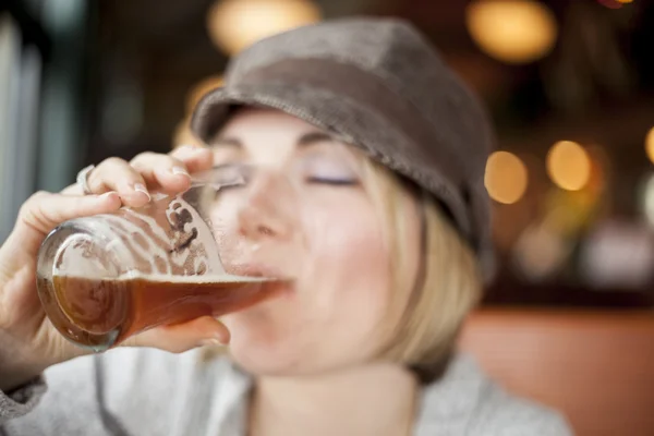 Young Woman Drinking Inda Pale Ale