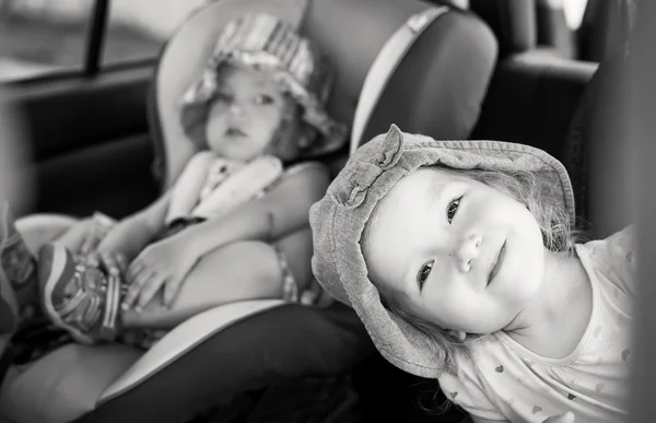 Playful children in the car