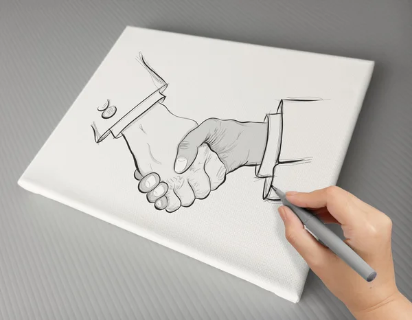 Hand drawn handshake sign as partnership business concept