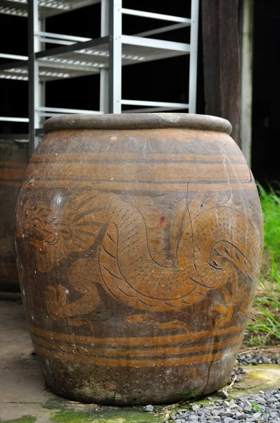 Ancient water jar with dragon