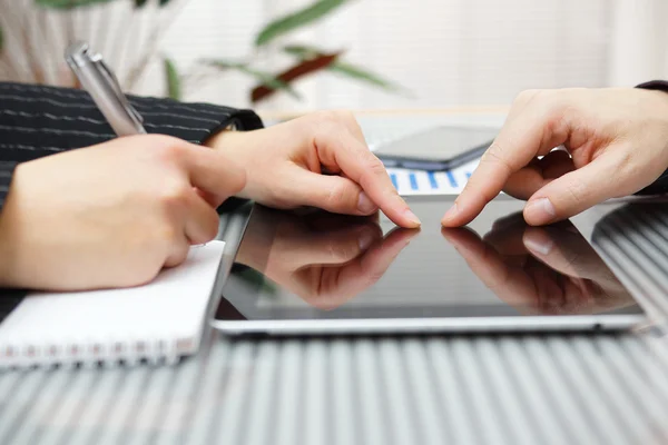 Woman and man working with digital tablet on business meeting in