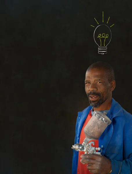 African black man industrial worker with chalk light bulb blackboard