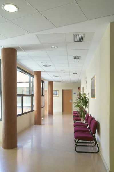 Hospital corridor with private medical offices.