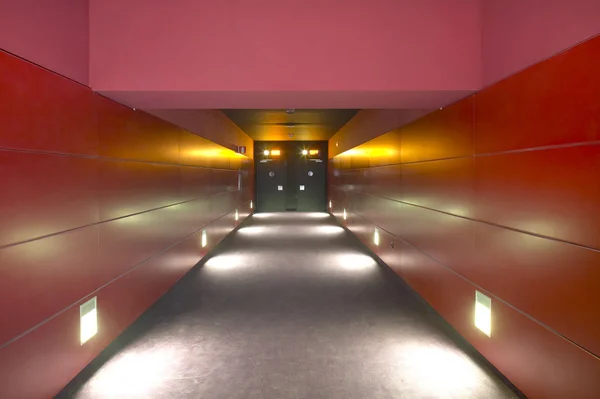 Interior corridor with doors. Horizontal. Red tone