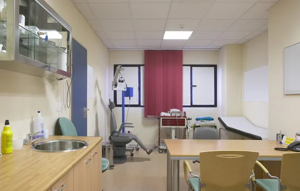 Hospital doctor room with medical equipment.