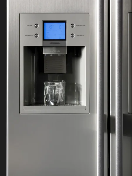 Fridge detail with ice dispenser and glass