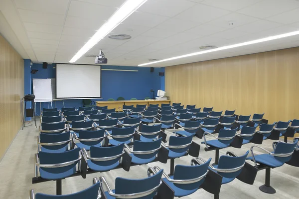 Conference room interior with projector and screen
