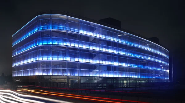 Modern building facade with blue light
