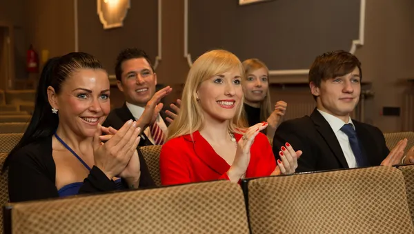 Theatre audience clapping and cheering