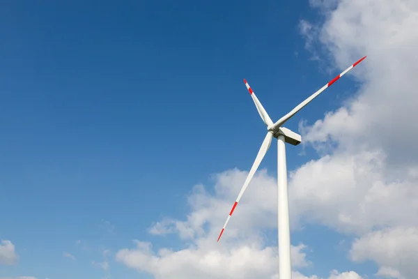Wind turbine for clean energy production with blue sky