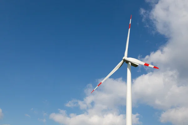 Wind turbine for clean energy production with blue sky