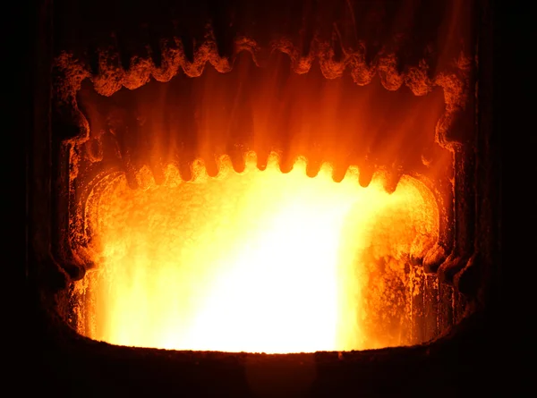 Colorful fire in industrial furnace.