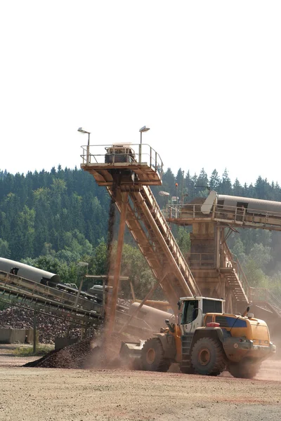 Loaders on the conveyor belt