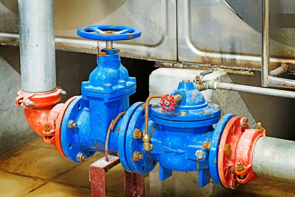 Pressure pump for running water in a building