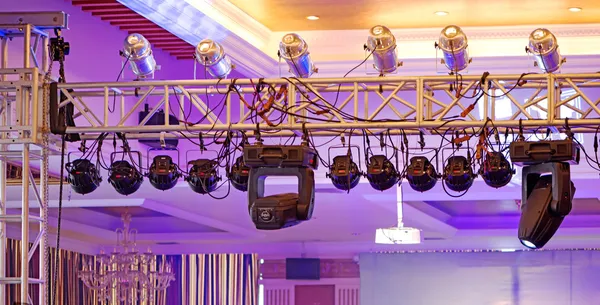 Studio lighting equipment high above an outdoor theatrical perfo