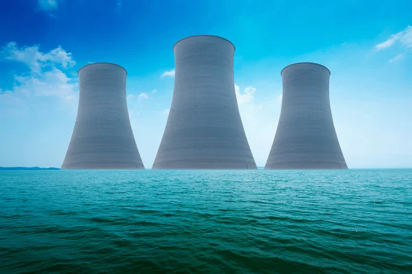 Nuclear power plant on the coast. Ecology disaster concept.