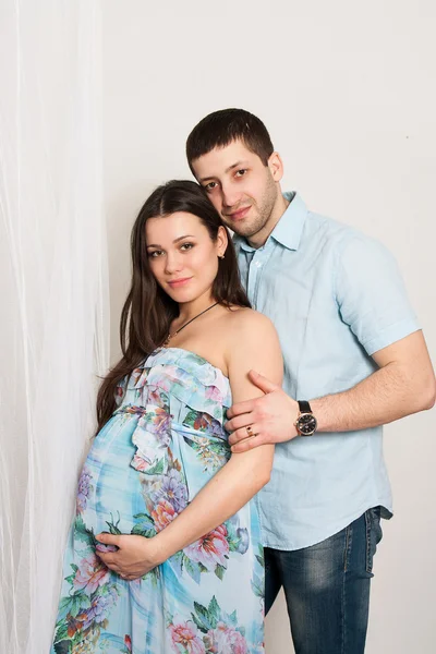 Portrait of happy couple expecting a baby.