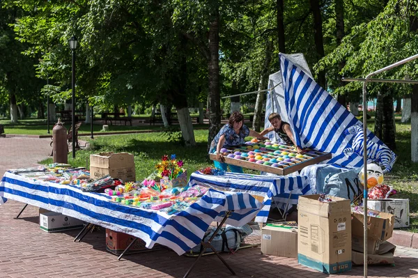 Trade stall with various stuff in park, Russia