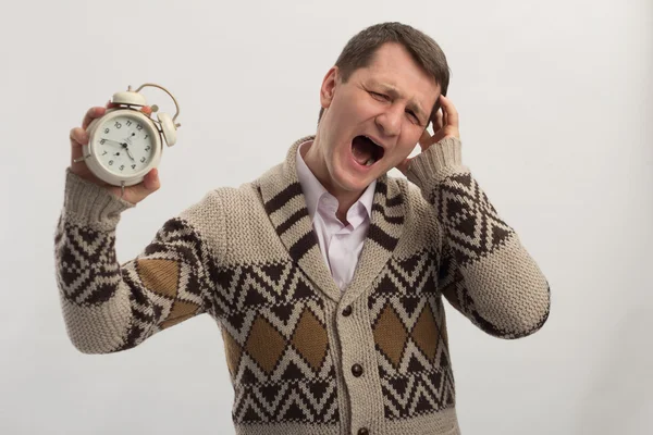 Yelling man with alarm clock in hand