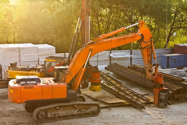 Modern orange excavator machines