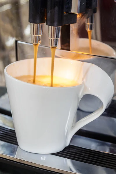 Coffee pouring into a cup