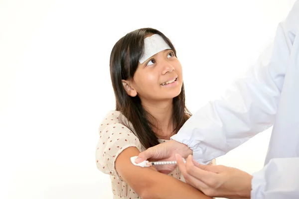 Child having physical examination