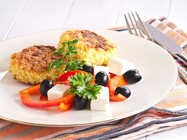 From rice patties with red pepper feta cheese olives salad