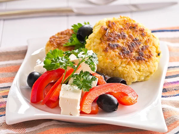 From rice patties with red pepper feta cheese olives salad