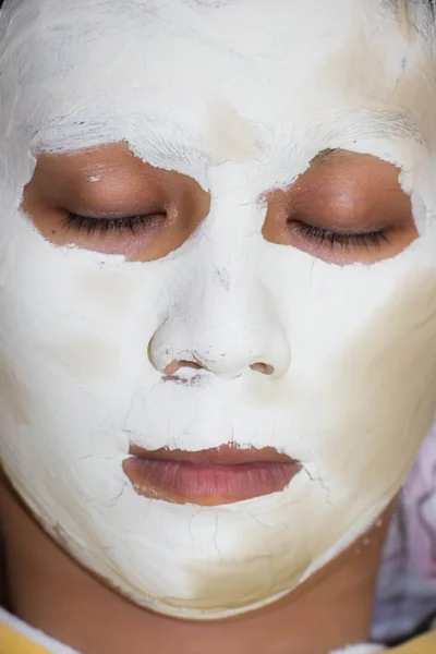 Close - up clay mask on face woman