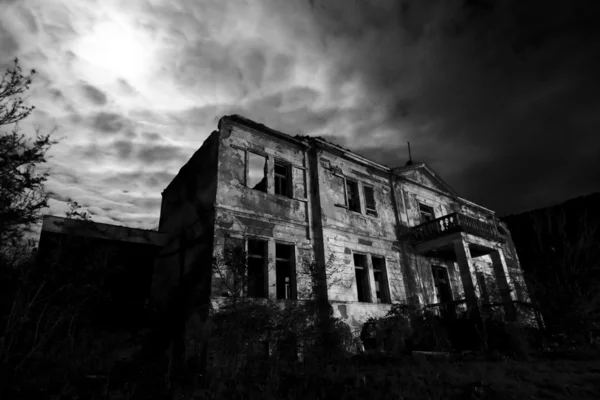 Abandoned spooky hotel at the night - horror movie scene